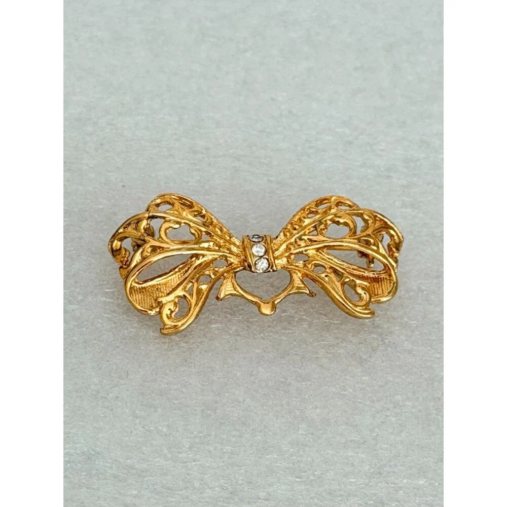Vintage Gold Tone Openwork Filigree Bow Brooch Rhinestone Accent Pin